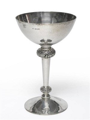 Lot 675 - An Arts & Crafts Silver Cup, Manoah Rhodes & Son Ltd, London 1923, the planished spreading foot...