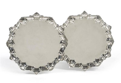 Lot 712 - A Pair of George III Silver Waiters, Richard Rugg, London 1762, shaped circular with shell and...