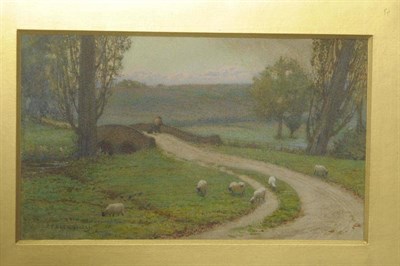 Lot 743 - Edward Frederick Brewtnall RWS (1846-1902) Sheep grazing beside a country lane Signed,...