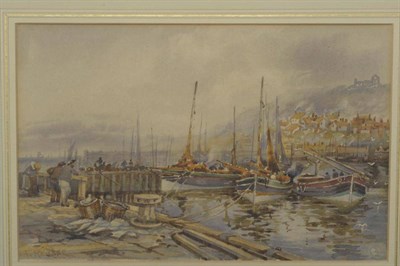 Lot 848 - Frank Rousse (fl.1897-1917) Whitby with figures and fishing boats in the foreground Signed,...