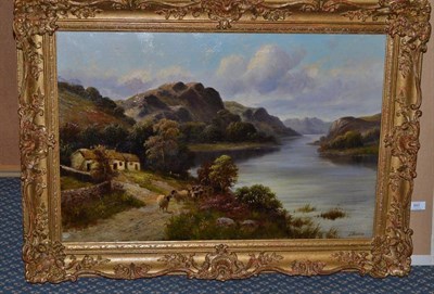 Lot 893 - F...Walters (19th century) Highland landscape with a drover and sheep on a path Signed, oil on...