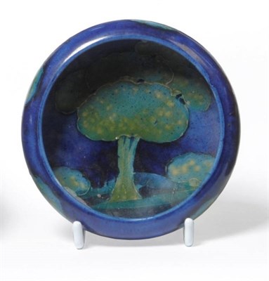 Lot 1137 - A William Moorcroft Moonlit Blue Landscape Pattern Dish, circa 1925, impressed factory marks...