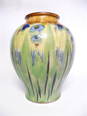 Lot 1148 - A Royal Doulton Stoneware Vase, by Vera Huggins, painted with blue iris, on a green and blue...