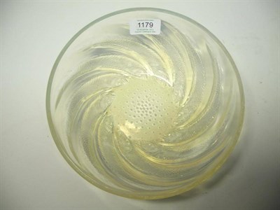 Lot 1179 - A René Lalique Poissons Opalescent Glass Bowl, the underside moulded in relief with spiralling...