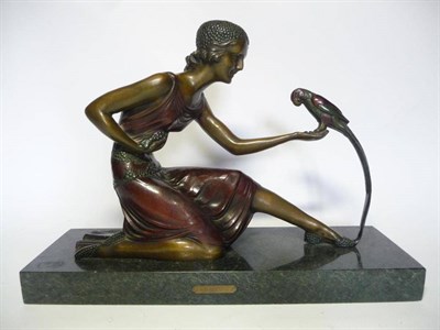 Lot 1189 - After D H Chiparus:  "Feeding " A Patinated Bronze Group, modelled as a young woman kneeling...