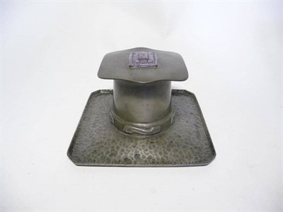 Lot 1207 - Archibald Knox (1864-1933) for Liberty & Co., An English Pewter and Enamel Inkwell, Model...