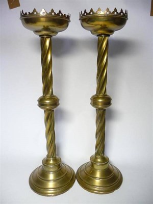 Lot 1210 - A Pair of Ecclesiastical Brass Candlesticks, the sconces with trefoil gallery, on a spiral...