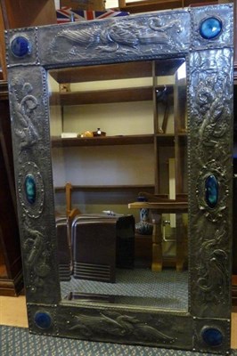 Lot 1213 - An Arts & Crafts Mirror, the rectangular pewter frame, embossed with dragons and riveted...