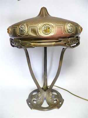 Lot 1218 - A German Jugendstil Brass Lamp, in the style of Eichberg, the trefoil stand supporting a dome jewel