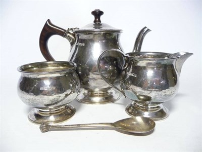 Lot 1221 - A Contemporary Arts & Crafts Silver Three-Piece Tea Service, by The Guild of Handicrafts,...