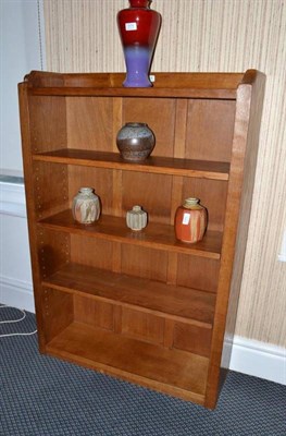 Lot 1225 - A Robert  "Mouseman " Thompson Oak 4' Open Bookcase, solid ends and panelled back, raised...