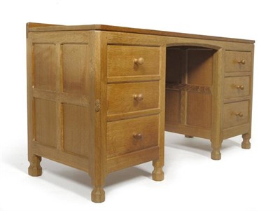 Lot 1227 - A Robert  "Mouseman " Thompson Panelled Oak Kneehole Dressing Table, with raised upstand above...