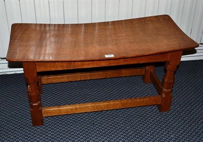 Lot 1243 - A Robert  "Mouseman " Thompson Oak Double Solid Seat Stool, on four octagonal legs joined by rails