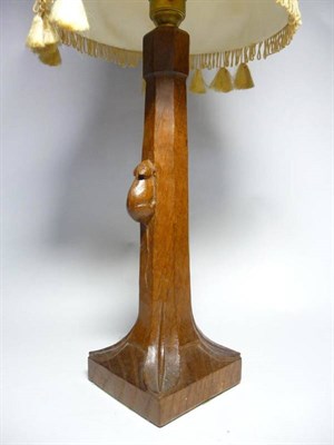 Lot 1244 - A Robert  "Mouseman " Thompson Oak Table Lamp, of octagonal form on a square base, with carved...