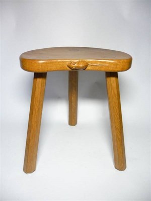 Lot 1248 - A Robert  "Mouseman " Thompson Oak Cow Stool, on three tapering octagonal legs, with carved...