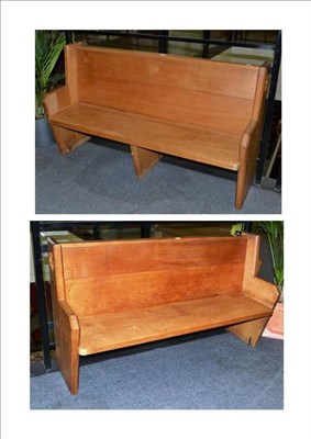 Lot 1262 - A Pair of Robert  "Mouseman " Thompson Oak Pews, the back with sectional book shelf, the shaped...