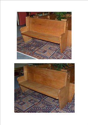 Lot 1263 - A Pair of Oak Pews, the back with full length book shelf, the shaped ends with carved...