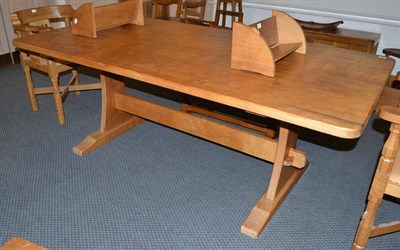 Lot 1270 - An Alan Grainger Acorn Industries Oak Refectory Table, on two shaped supports joined by a...