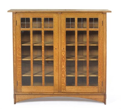 Lot 1278 - Gustav Stickley (American, 1858-1942) An 5' Oak Bookcase (model 704) designed by Harvey Ellis,...