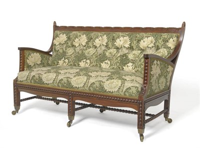 Lot 1280 - A William Morris & Co Settee, circa 1890, the mahogany frame bobbin decoration, with outward...