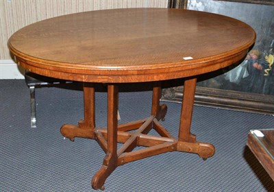 Lot 1281 - A Gothic Revival Oak Centre Table, the oval top with moulded edge, on four legs joined by a...