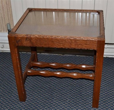 Lot 1286 - A Stanley Webb Davies Oak Coffee Table, with chip decoration, on four legs joined by a H stretcher