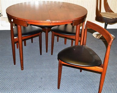 Lot 1296 - A 1960's Danish Teak Dining Room Suite, comprising an Extending Circular Table, on four...