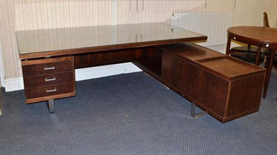 Lot 1298 - A 1960's Rosewood and Chrome L-Shaped Desk, the rectangular top on two chrome supports above...