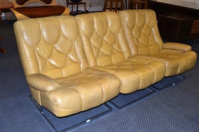 Lot 1303 - A Modern Tan Leather Three Section Sofa, on chrome supports, labelled 12 # Gibb 27-Aug-2009...