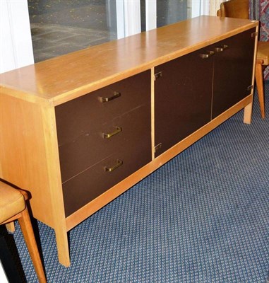 Lot 1309 - A 1970's Beech and Brown Laminate Sideboard, the rectangular top over three drawers and two...