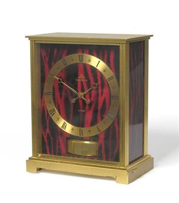 Lot 1326 - A Gilt Brass Atmos Clock, Model: Embassy, signed Jaeger LeCoultre, circa 1975, with red and...