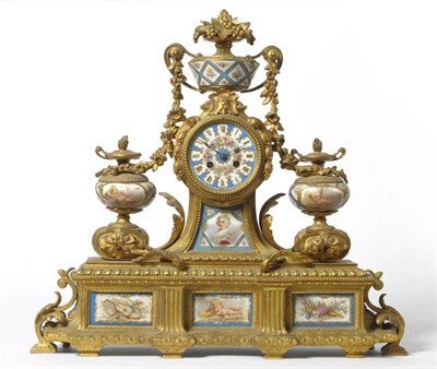 Lot 1330 - A French Gilt Metal and Porcelain Mounted Striking Mantel Clock, circa 1890, surmounted by an...