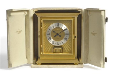 Lot 1332 - A Gilt Brass Atmos Clock, Model: Royale, circa 1970, the concealed case with hinged front door,...