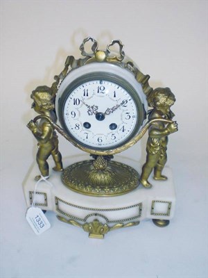 Lot 1333 - A White Marble Striking Mantel Clock, circa 1890, with gilt bronze mounts and flanked by putti,...