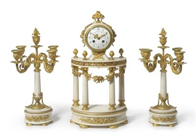 Lot 1339 - A French Gilt Metal and White Marble Striking Clock with Garniture, circa 1890, with swag...