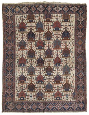 Lot 1377 - Afshar Rug South East Persia The ivory field with columns of heraldic devices enclosed by...