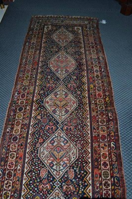 Lot 1401 - Narrow Kashgai Runner South West Persia The deep indigo field of millefleur design around a...