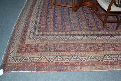 Lot 1412 - An Unusual Malayir Carpet West Persia The mid indigo field with columns of stylised boteh...