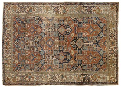 Lot 1414 - Unusual Heriz Carpet Persian Azerbaijan The terracotta field with a complex allover reciprocal...