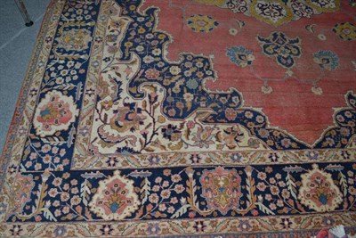 Lot 1419 - Tabriz Carpet  Persian Azerbaijan The coral field sparsely decorated with angular vines centred...