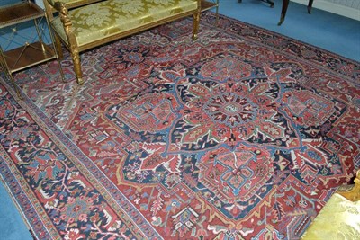 Lot 1421 - Rare Signed Heriz Carpet Persian Azerbaijan The madder field of angular vines around an indigo...