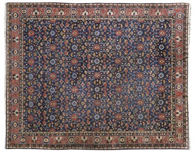 Lot 1423 - North West Persian Carpet, of unusual size Probably Persian Azerbaijan The deep indigo lattice...