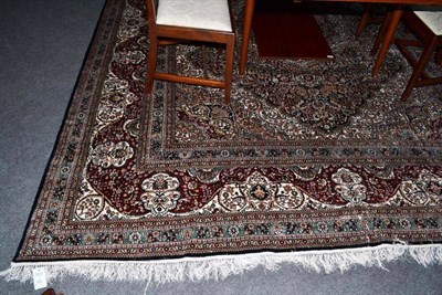 Lot 1428 - A Finely Woven Chinese Silk Carpet The indigo field richly decorated with floral vines around...