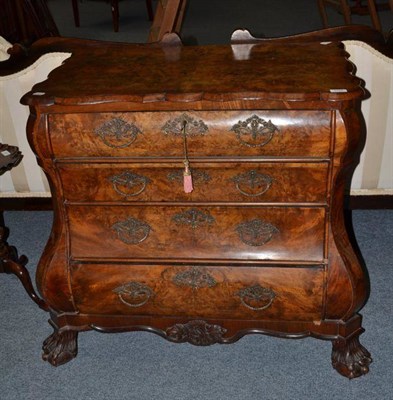 Lot 1444 - A Dutch 18th Century Style Walnut Commode, of bombé shaped form, the quarter-veneered top with...