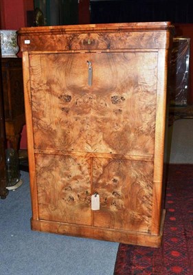 Lot 1446 - A North European Figured Walnut Secretaire à Abattant, late 19th century, the frieze drawer...