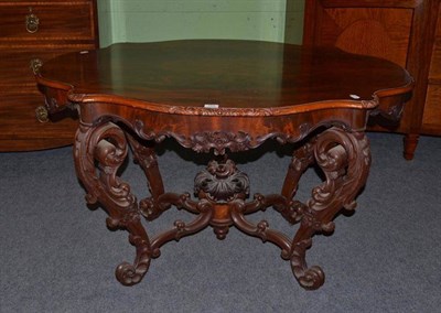 Lot 1448 - A 19th Century North European Mahogany Centre Table, of serpentine shaped form with...