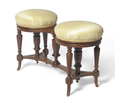 Lot 1455 - An Edwardian Walnut Revolving Piano Duet Stool, circa 1900, recovered in modern silk fabric,...