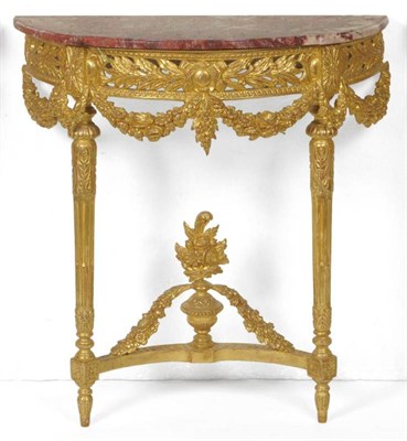 Lot 1465 - A Gilt and Gesso Demi-Lune Console Table, with rouge royale marble top above a foliate frieze...