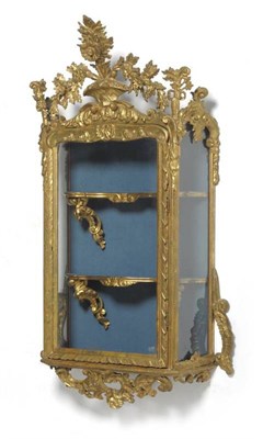 Lot 1467 - A 19th Century Gilt and Gesso Rococo Style Glazed Wall Cabinet, with central glazed door...