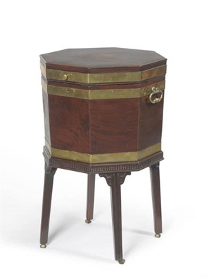 Lot 1468 - A George III Mahogany Octagonal Wine Cooler, circa 1800, the hinged lid with floral patera...